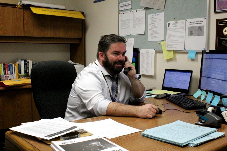 Assistant
principal Joey
Serra III talks
on the phone in
his new office
Sept. 16. This is
Serra’s first year
at Lakewood.
“I’m extremely
busy but
grateful for all
of the students
and faculty that
welcomed me,”
Serra said.