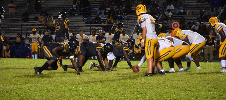 Lakewood's defensive line gets ready for Gibbs High School to start the play  on Sept. 11. The Spartans beat Gibbs 42-0.