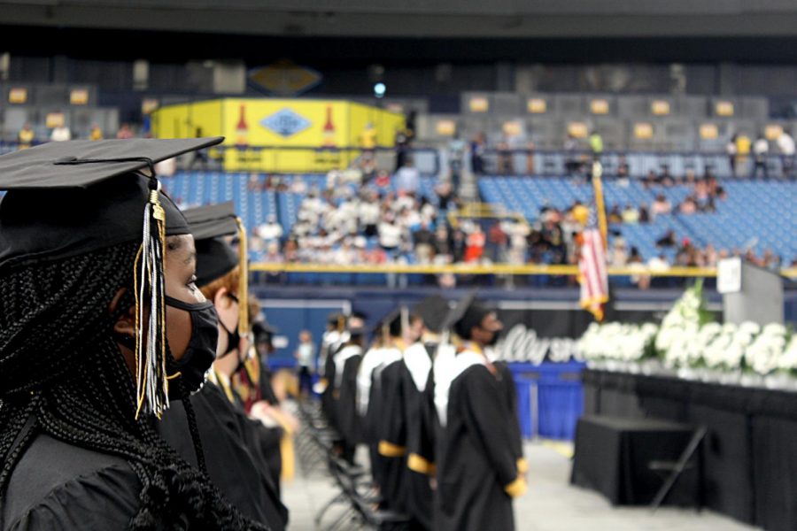 The graduating class of 2021 stands for the Star Spangled Banner on June 3 in Tropicana Field. Photos By ANTHONY SNEAD