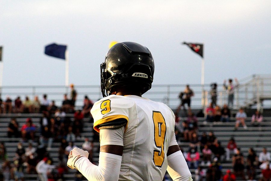 Senior Amari Niblack looks out at the crowd between plays at the game against Boca Ciega high school on Aug. 26.