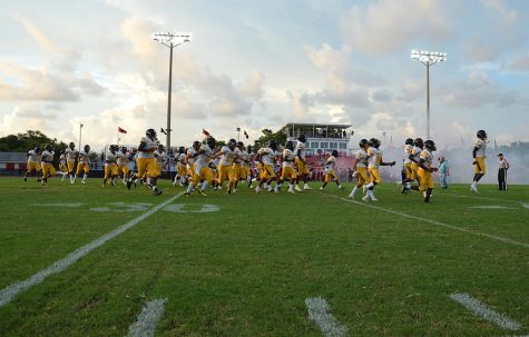 The Lakewood Spartans cheer and holler as they run out on the Palmetto High School football field on Friday (9/3). The Spartans faced the Palmetto Tigers winning the game with a score of 15-6. Three (DESTINI GONZALEZ| SNN) 