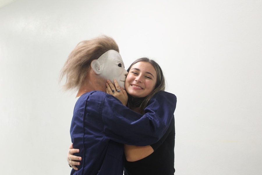 Senior Jack Land kisses senior Emma Ash while dressed as Mike Myers for Throwback Tuesday. 