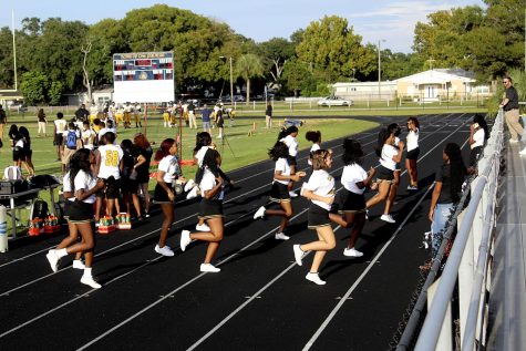 Cheerleaders practice at Boca Ciega High School before a game.