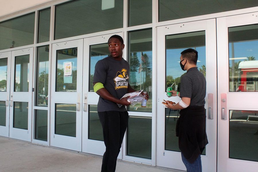 Senior Brandon Stephens and Steven Bo leave to go back to class after they had their blood taken on Sept. 21. 