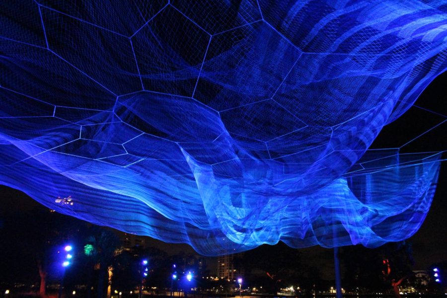 A sculpture called Bending Arc at the St. Petersburg Pier glows blue one evening in mid-September. The sculpture was created by artist Janet Echelman.