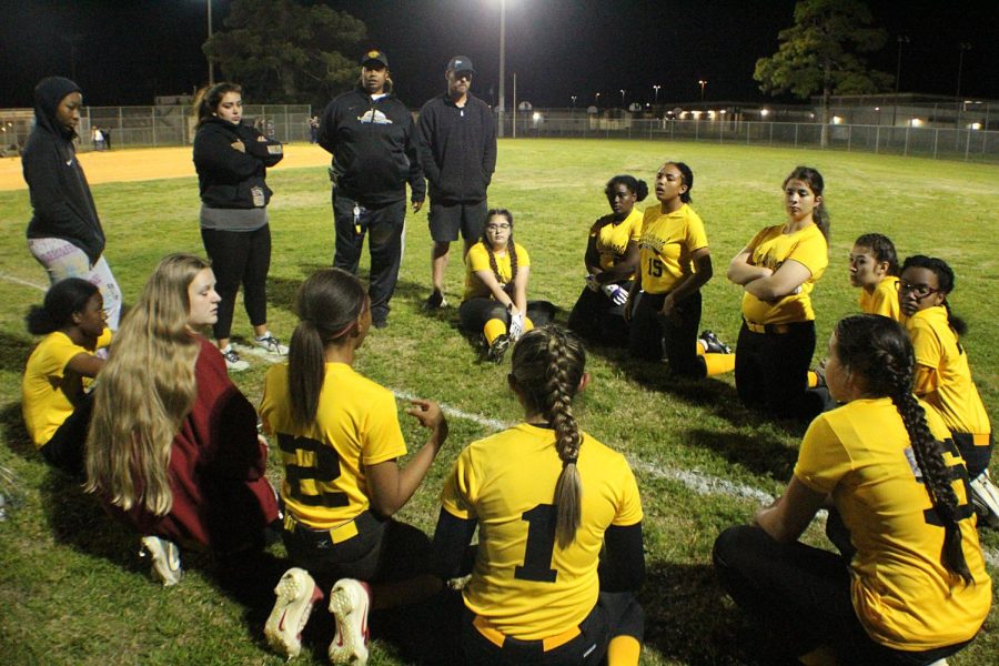 Coaches+Melia+Garcia+and+Necole+Tunsil+talks+to+the+softball+team+after+they+lost+to+Gibbs+High+School+on+March1+at+Lake+Vista.+