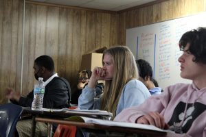 Sophomore Jordan Mclntosh sits and listens to the guitar group play in Spanish teacher Lydia Harless' class on March 9, 2020. 