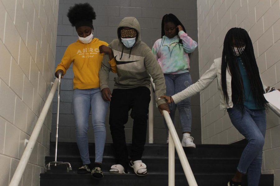 Students in health sciences teacher Erika Miller's class walk down the steps in C-wing on Feb. 9.