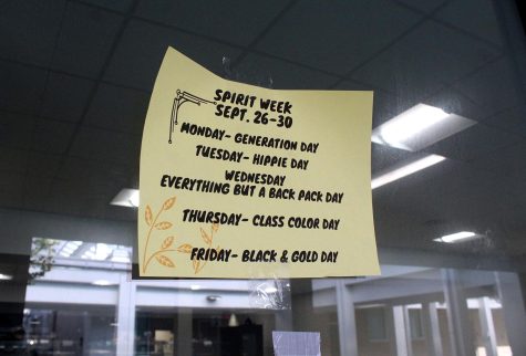 A flyer for Lakewood Spirit Week is put up on the cafeteria windows. It covers the themes for each weekday, Monday Sept. 26 through Sept. 30.