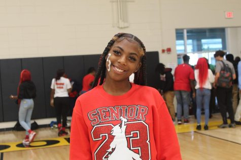 Senior Makieha Smith poses for a photo in the gym on Oct. 14 after taking the senior yearbook photo.