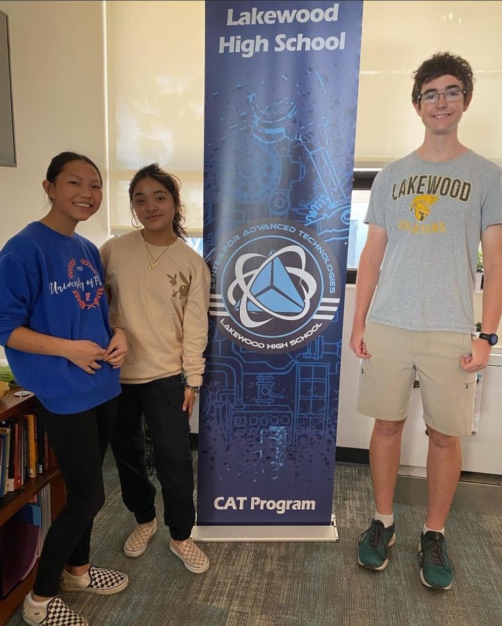 Junior Macie Sullivan, left, senior Zitlaly Lora and senior Noah Adelson stand in the CAT office on Dec. 13 after receiving scholarships. Sullivan won the STEM Sunshine State Scholar, Lora won the Promise Foundation Scholarship and Adelson won first place in an essay contest sponsored by the US district court.