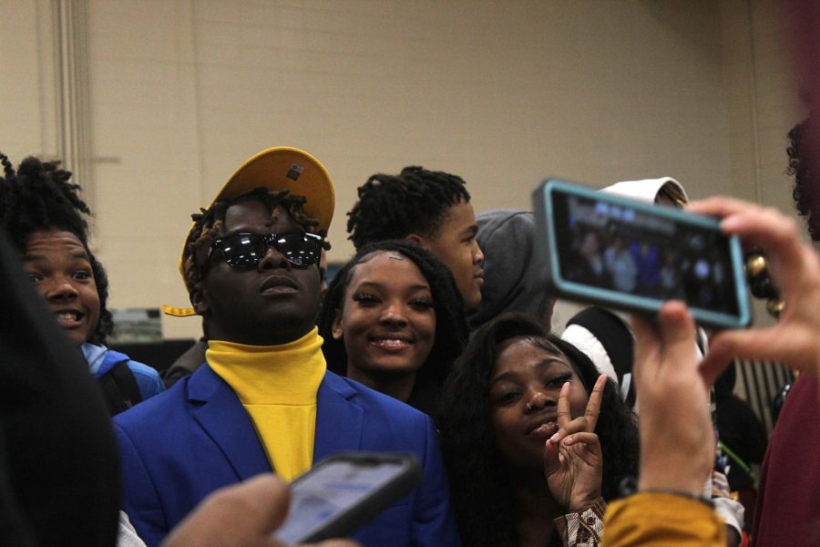 Senior Montravius Lloyd poses for a picture with friends after he signed to Pittsburg University on Dec. 21.