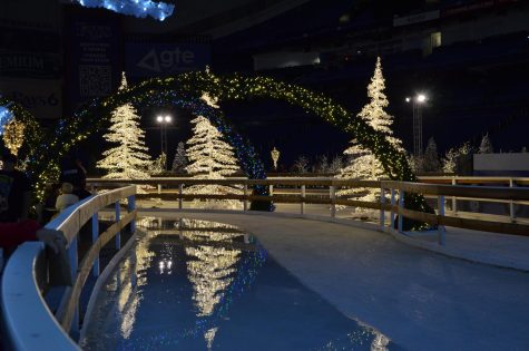 Lit trees reflect off the ice rink in the Enchant display. Attendees could use the ice rink for a fee of $18.