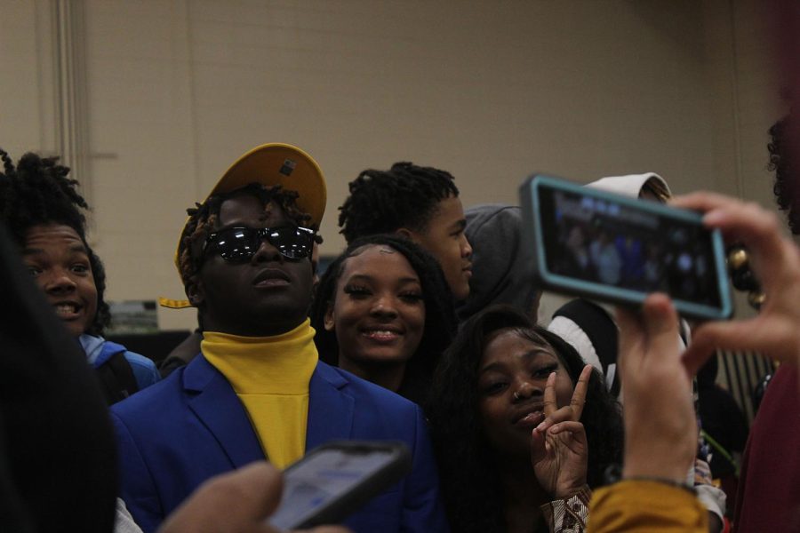 Montravius Lloyd poses for a picture with friends after he signed to Pittsburg University on Dec. 21.