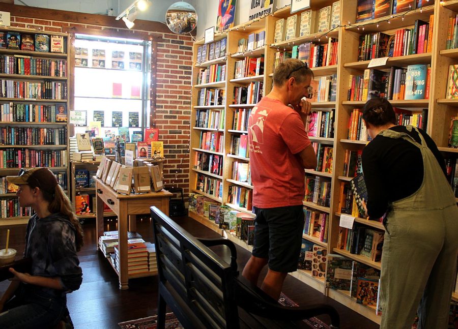 Patrons of Tombolo Books browse the store on Dec. 5.