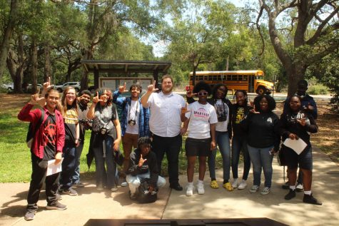 The CJAM class poses during their Sawgrass Lake Park field trip on April 20, 2023. Students practiced nature photography capturing plants and wild animals. It was a fun trip, junior Xavier Drake said. 