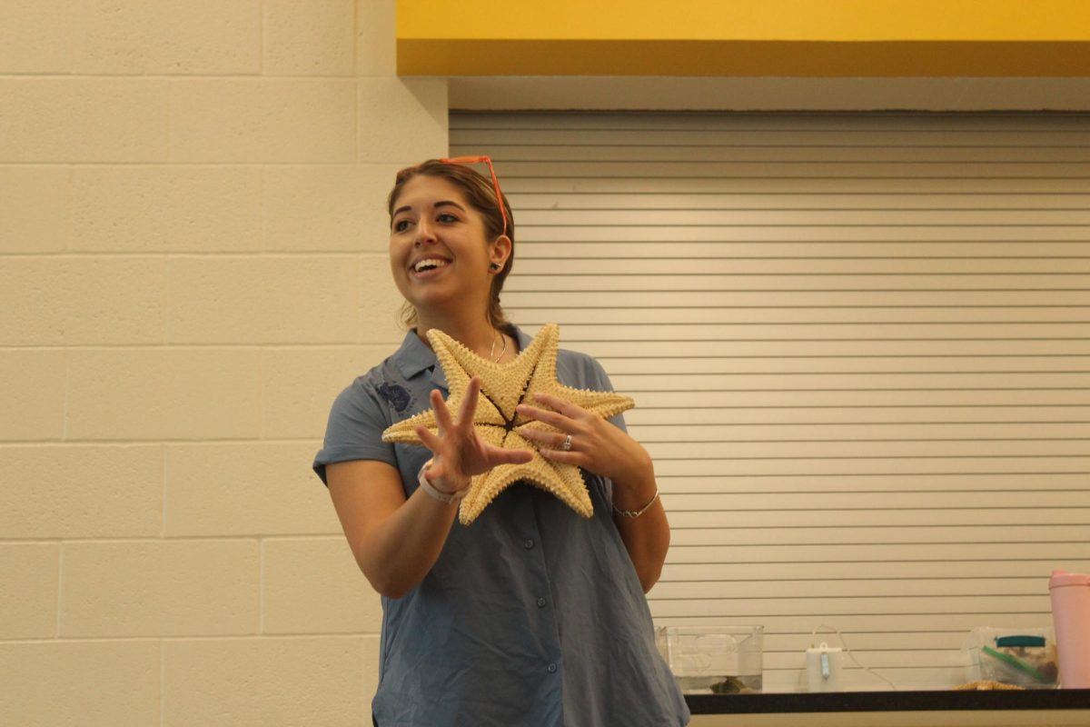 Zoe Caraffi holds a sea star when presenting to the Lakewood students. Sea stars, also known as star fish, are a vital part of the Florida estuary. 