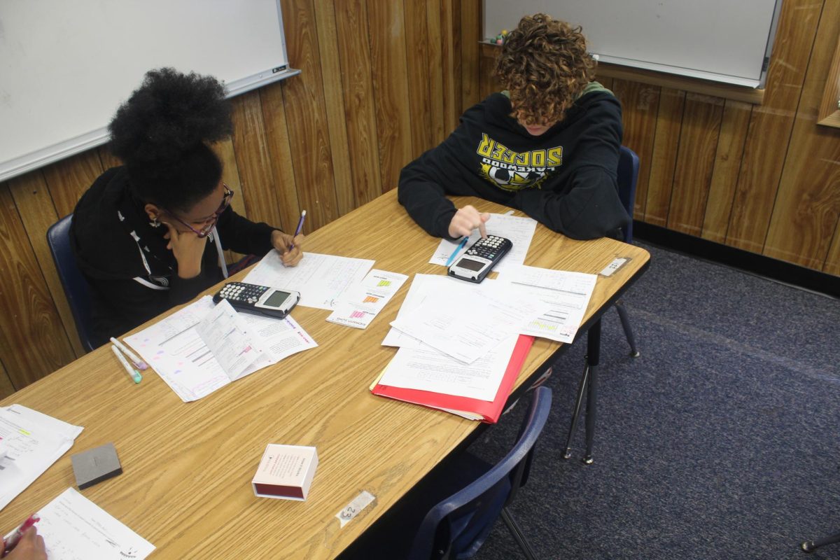 DeMarria Raiford and Siena Van Beynen complete math practice questions on Feb. 2 in Syreta Sneads classroom. Students were practicing for an upcoming test.