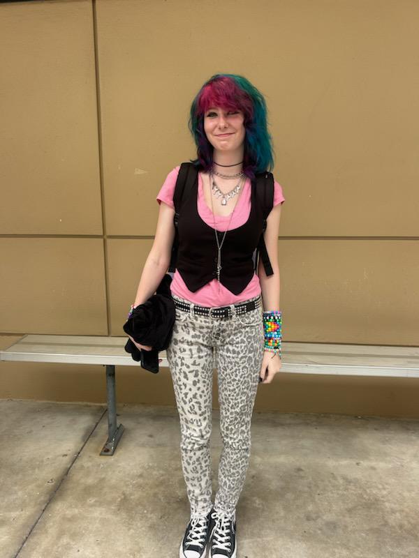 Mikayla Harper gives punk rock vibes with her pink shirt, black vest and spotted pants.