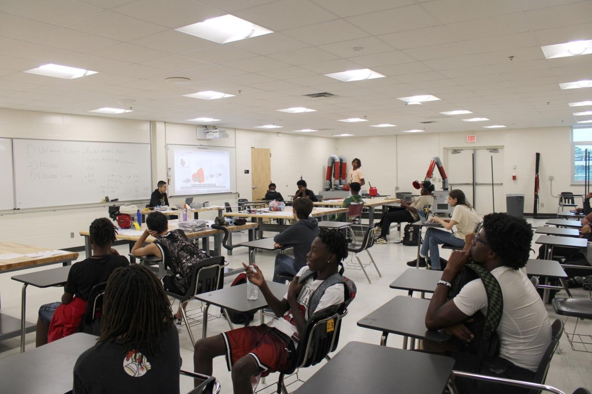 Students learn about car mechanics in Nate Cortez's new automotive course. 