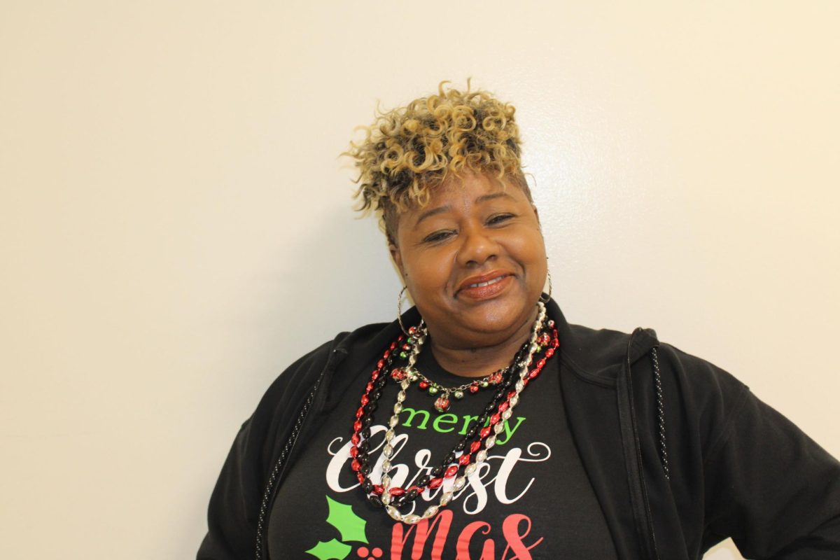 English teacher Delia Doss shows her festive spirit in a fun T-shirt and bells August 14, 2024. She teaches AP Seminar during sixth period this year.