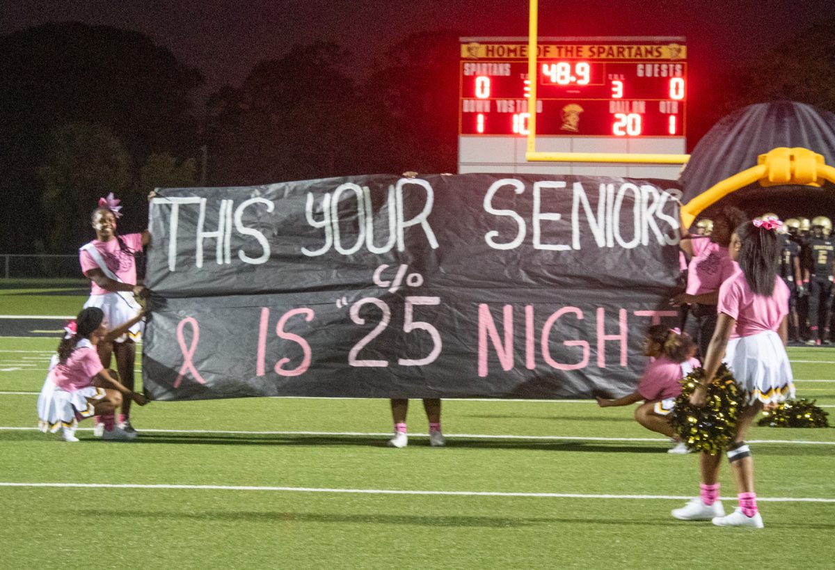 The Hollywood High cheer team holds up an amazing sign for Lakewood's Senior night game, located at our very own football field. The sign was created by the cheerleaders.