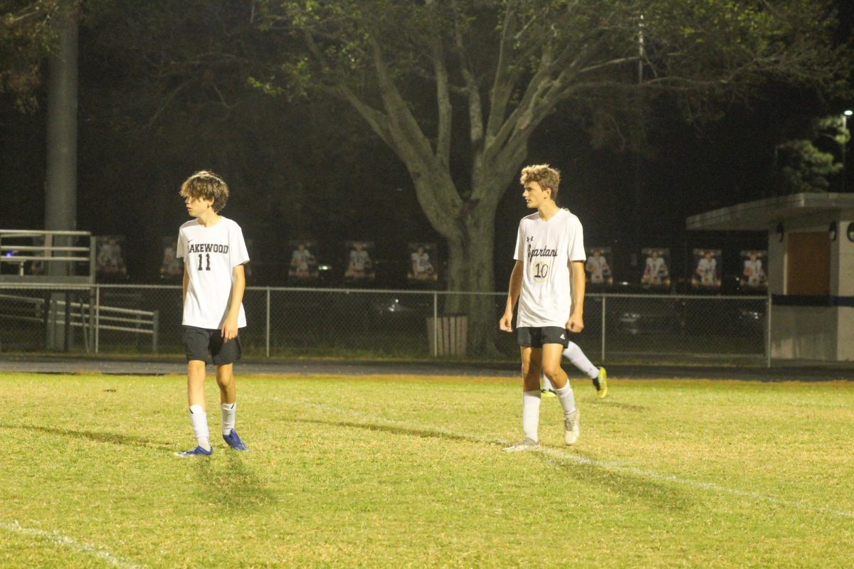 Freshman Cameron Hefty and Parker Sinclair walk down the field to prepare to defend the goal.