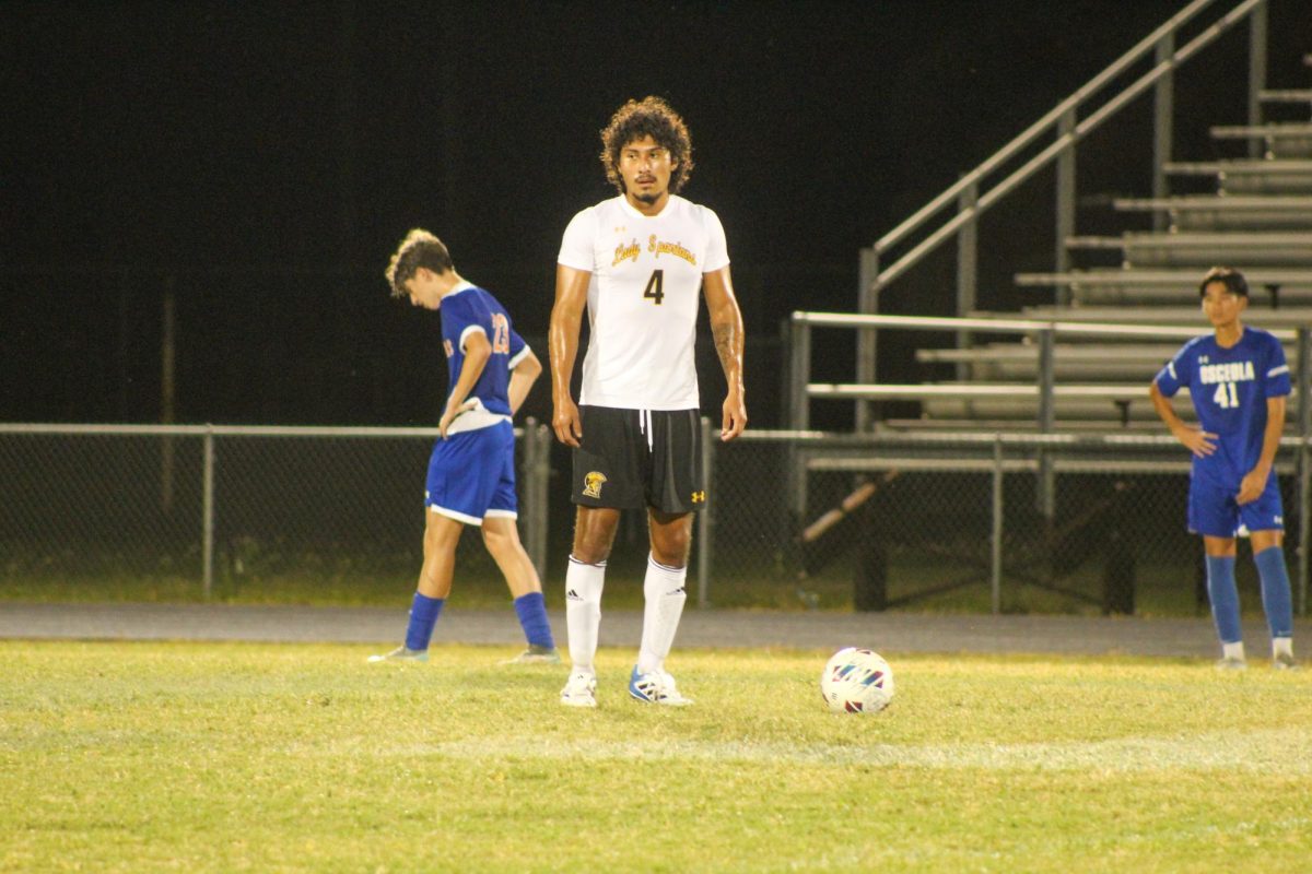 Senior Alex Vogeler looks around the field to make the best pass to his teammates.