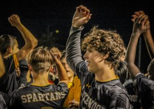 The Spartans Soccer team does their chant before the game starts.