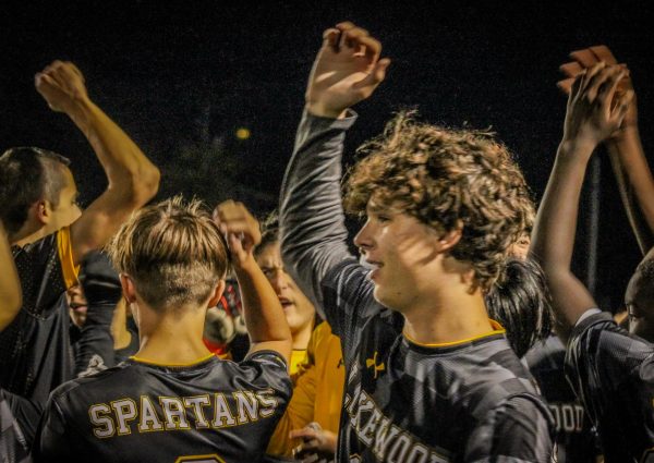 The Spartans Soccer team does their chant before the game starts.