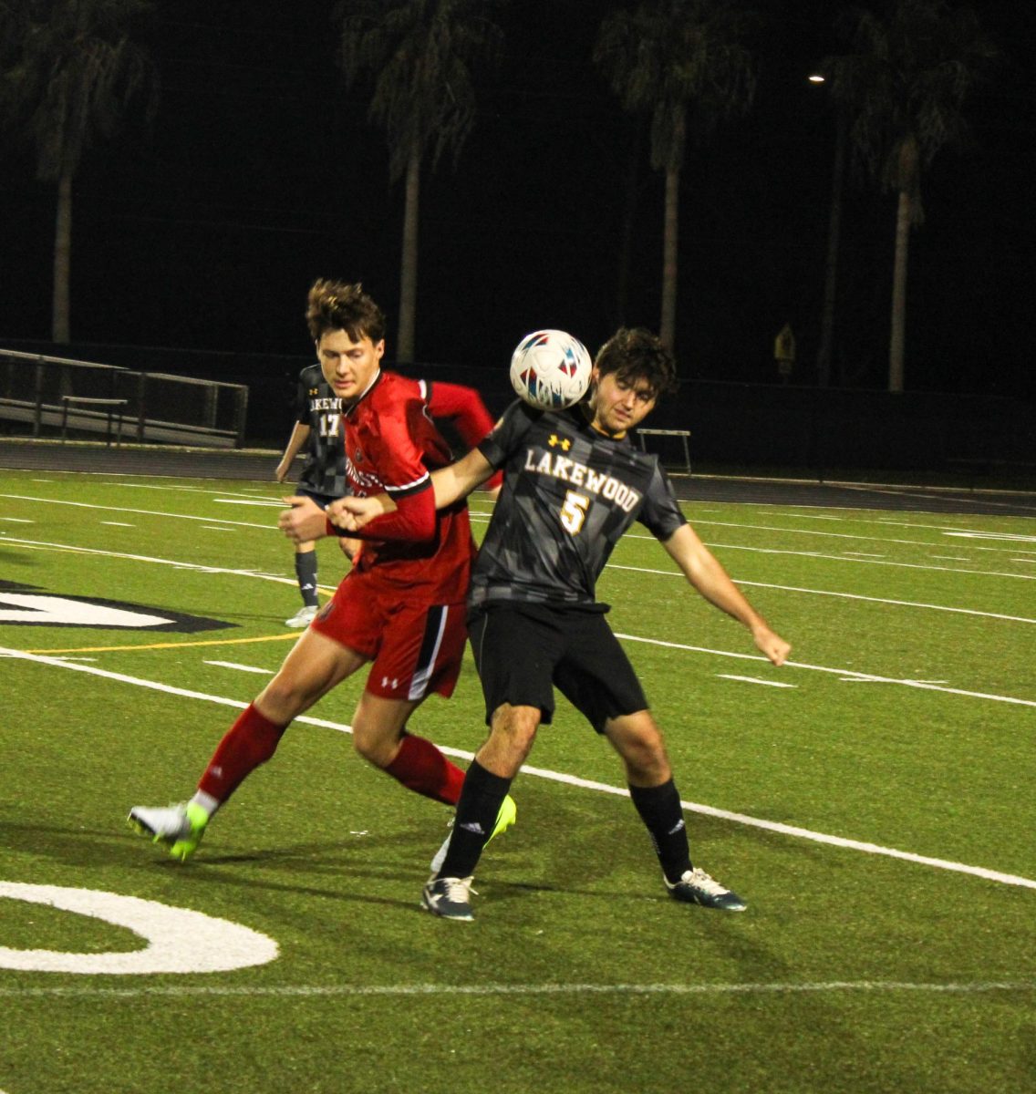 Senior Seren McNulty defends the ball from the opposing team.