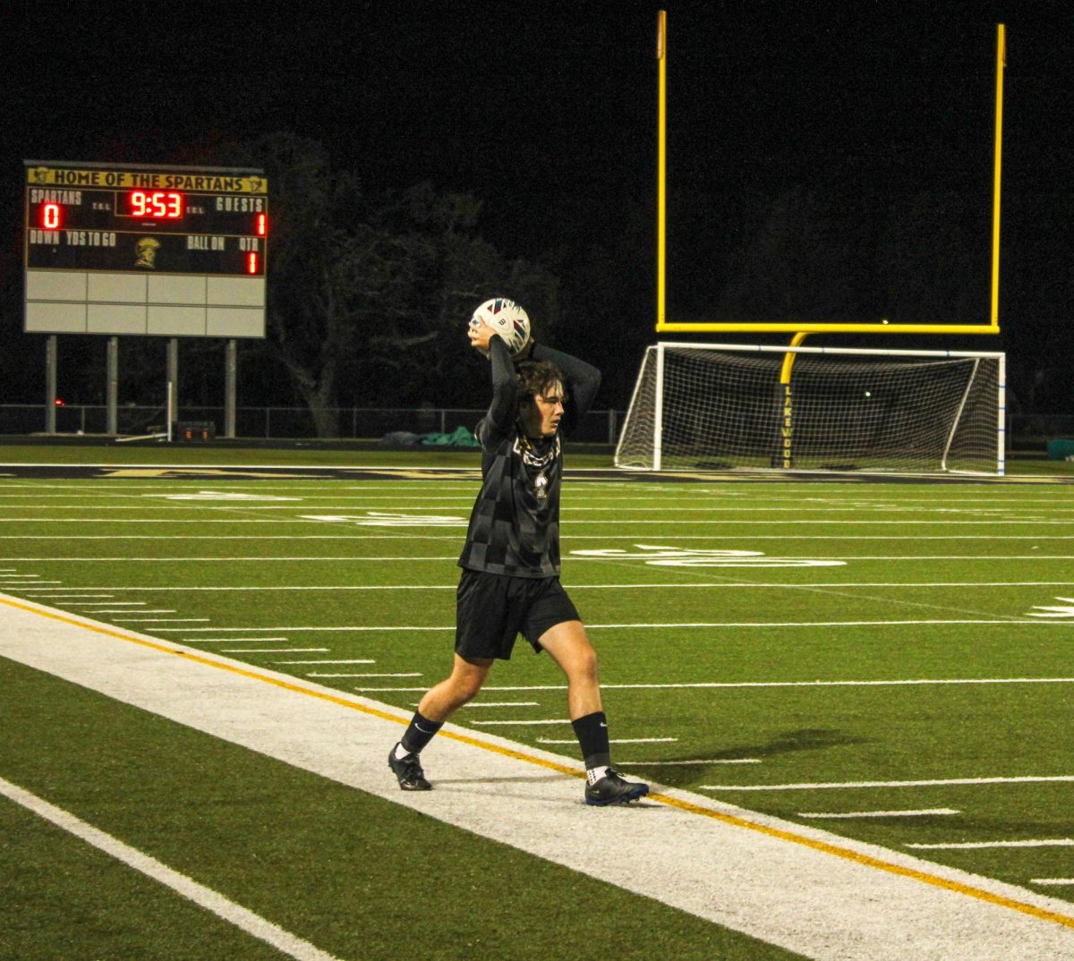 Sophomore Cannon Rice does a throw in and passes the ball to his teammates.