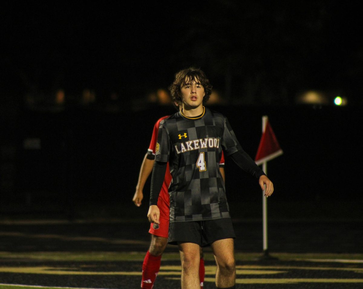 Sophomore Cannon Rice looks over the field and watches the game play by play.