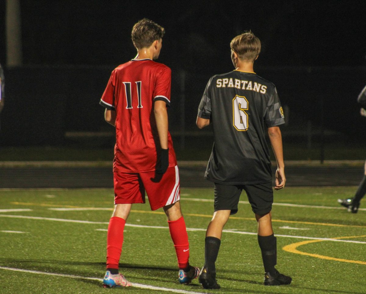 Sophomore Joel Burnsed shows good sportsmanship talking with the opposing team.