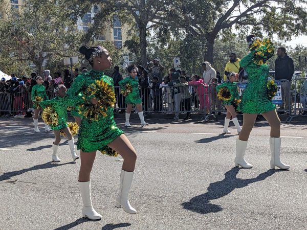 PAL cheerleaders shake thier pom-poms and dance for the crowd. St. Pete PAL provides a place for kids when thier not in school, surrounded by adults that provide an educational environment.