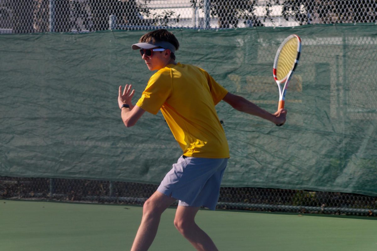 Senior Calvin Repka swerves back to strike the ball at the Lakewood v. Gibbs game.