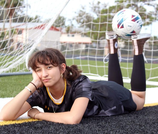 Junior soccer player Irene Laclaustra lounges on the Spartan soccer field. She plays number 11 on the Lakewood soccer team. "Being out on the goal again reminds me of the fun times at games," said Laclustra.