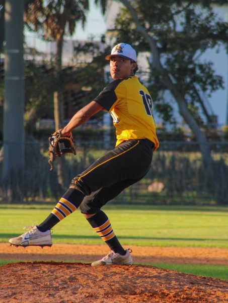 Senior Kayetano Cavillo pitches on the mound during the baseball game against Gibbs High School.