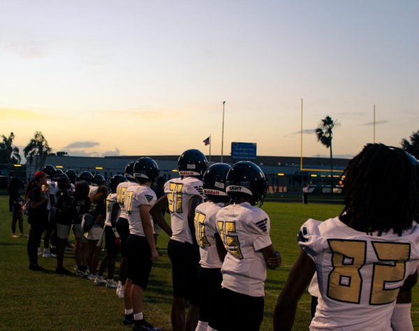 Lakewood Spartans players watch from the sideline as their teammates battle it out under the Friday night lights. The team's focus and energy helped spark a huge second-half comeback at the Lakewood V. Boca Ciega Game on October 2nd at Boca Ciega High School.