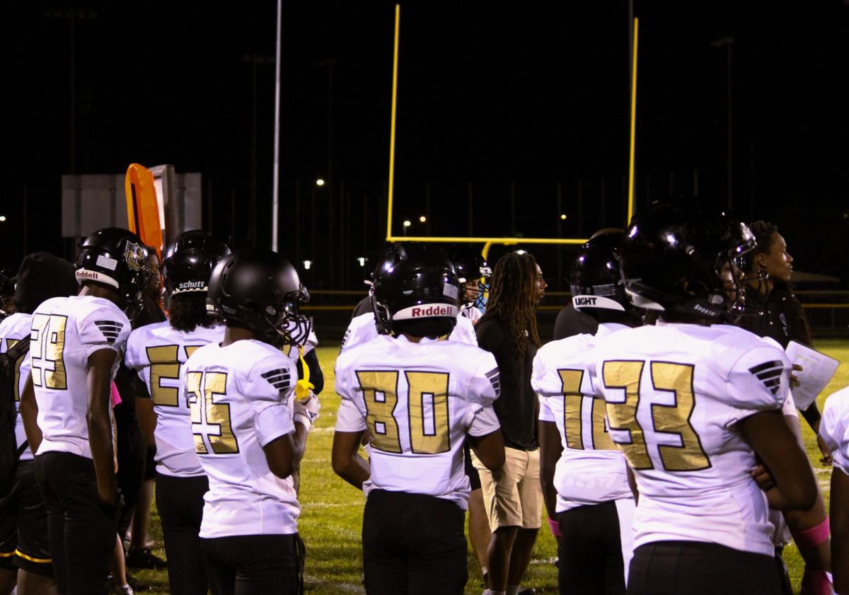 Lakewood players line the sideline as the game heads into the final minutes at Gibbs High School. Some watch the field while others talk strategy with teammates and coaches. The Spartans stay locked in and supportive until the final whistle, showing how the team’s focus doesn’t fade, win or lose.