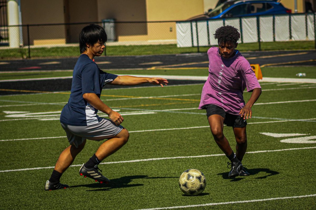 Sophomore Christian Or and Freshman practice the triangle during tryouts on October 15th. Or guards Freshman during thr drill. "Tryouts on behalf of everyone went well, I guess since they were eager to please the new Coach Mr. Mills who I'm excited to work wiith," says Or.