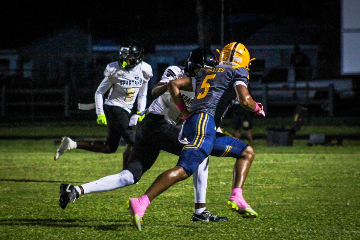 Senior Malique Harrell tracks down the Boca Ciega football player and prepares to tackle him to prevent Boca Ciega to get an interception.