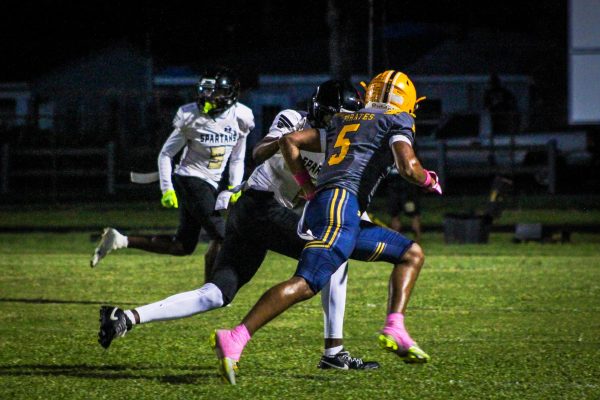 Senior Malique Harrell tracks down the Boca Ciega football player and prepares to tackle him to prevent Boca Ciega to get an interception.
