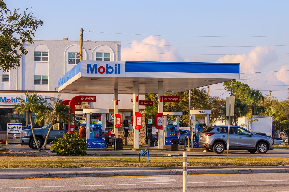 This is a image of cars around the gas station obtaining some gas for their cars. This was mid-day around 6-7pm. "Welcome in man" was said once i walked in by the gas station clerk.
